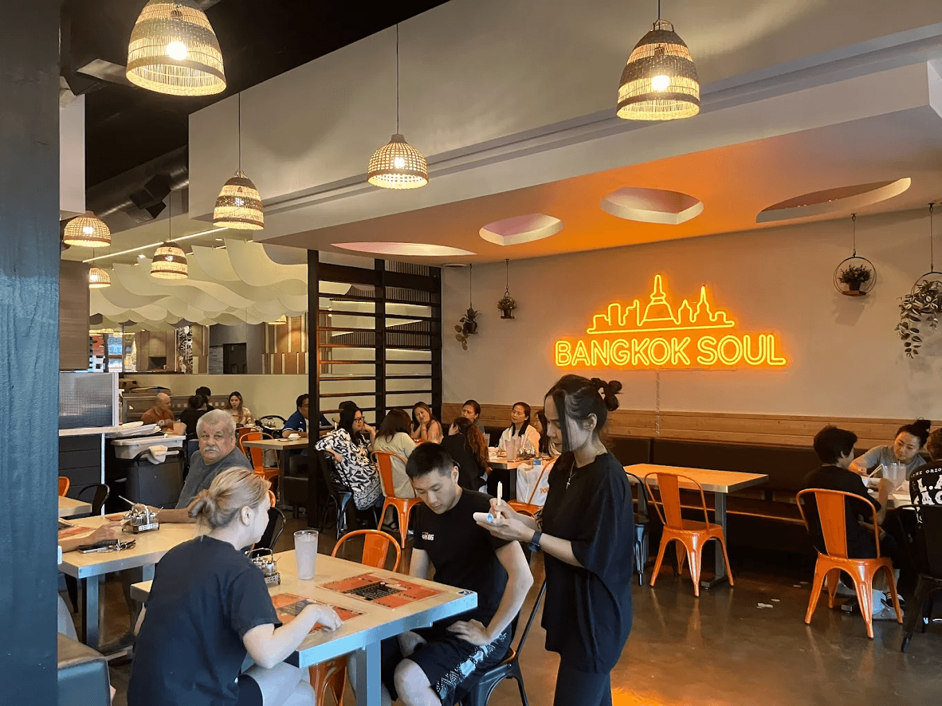 Authentic Thai food spread on a rustic wooden table